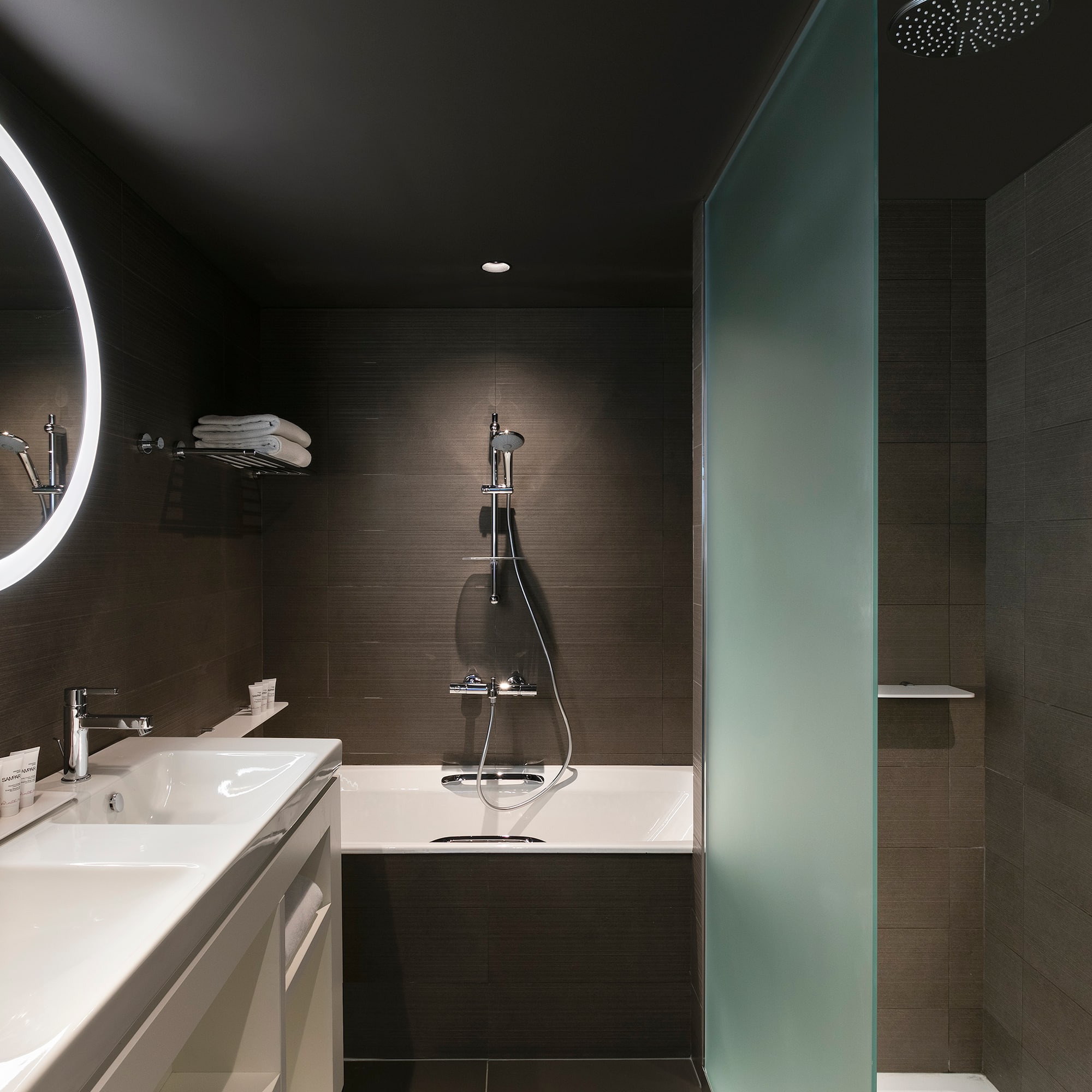 a bathroom with a shower and sink