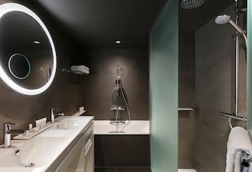a bathroom with a shower and sink