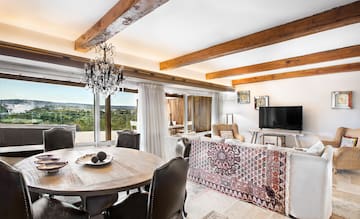 a living room with a table and chairs