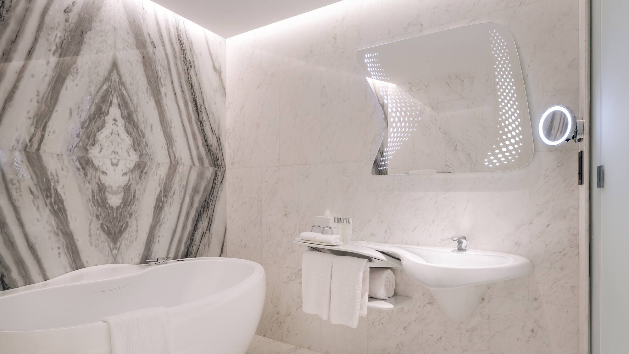 a bathroom with a tub and sink