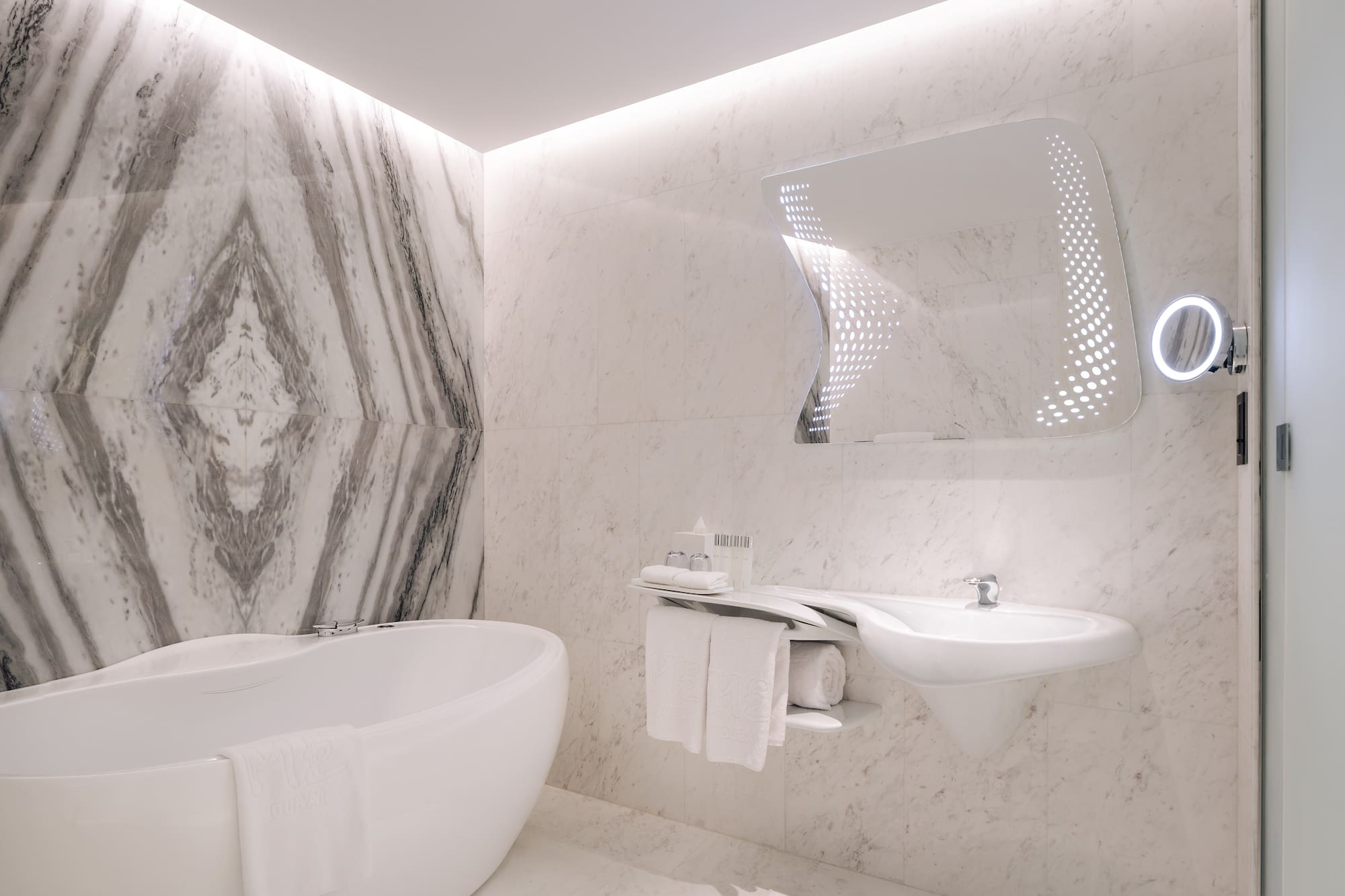 a bathroom with a tub and sink