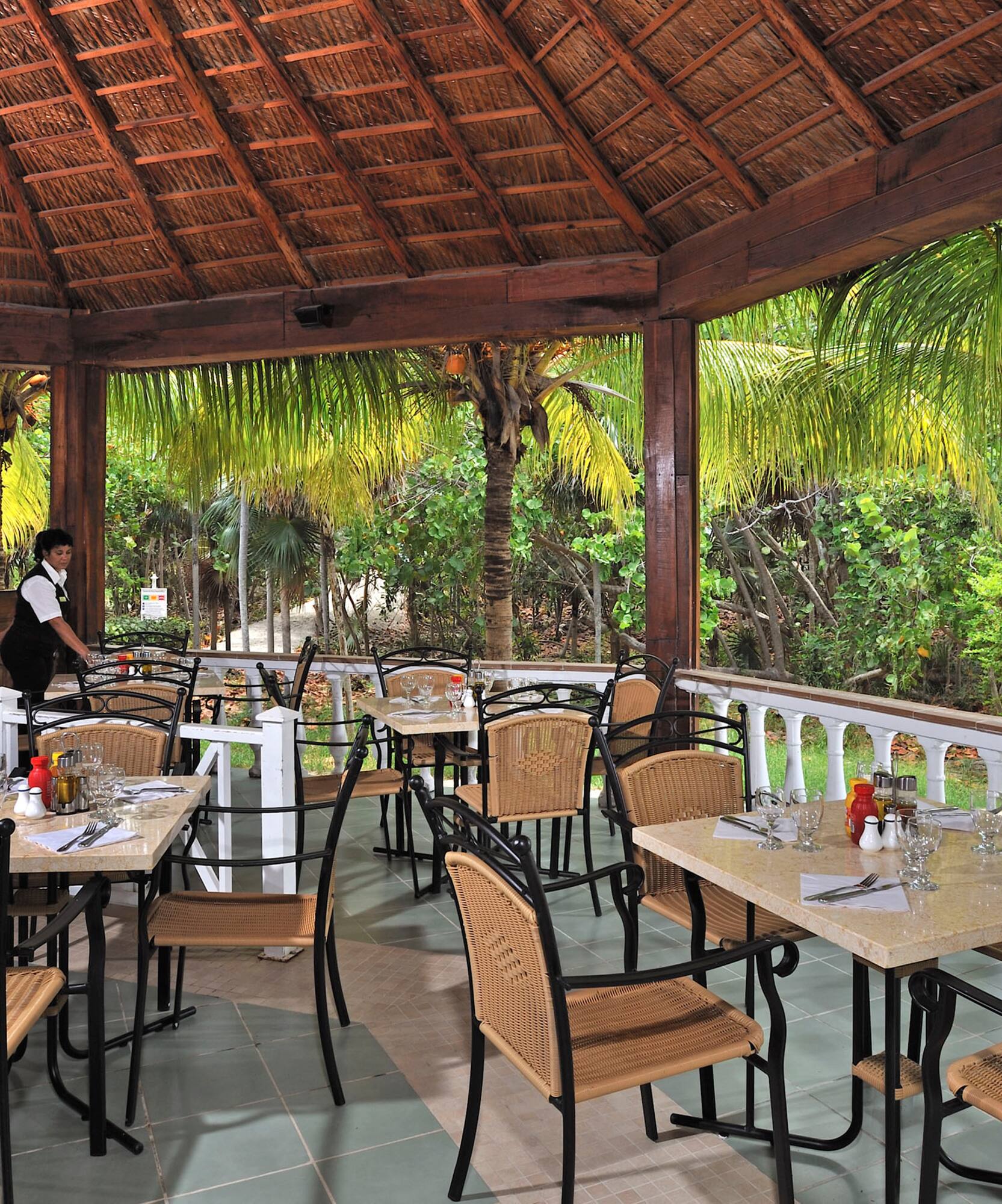 a restaurant with tables and chairs