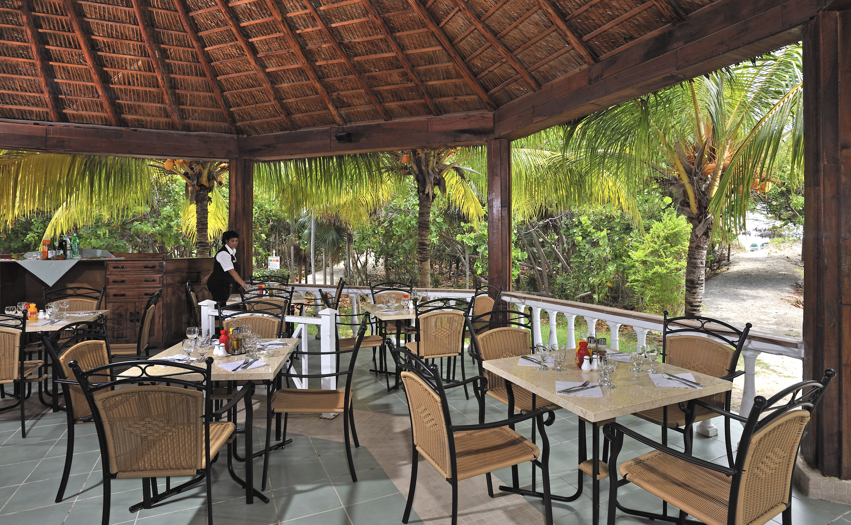 a restaurant with tables and chairs