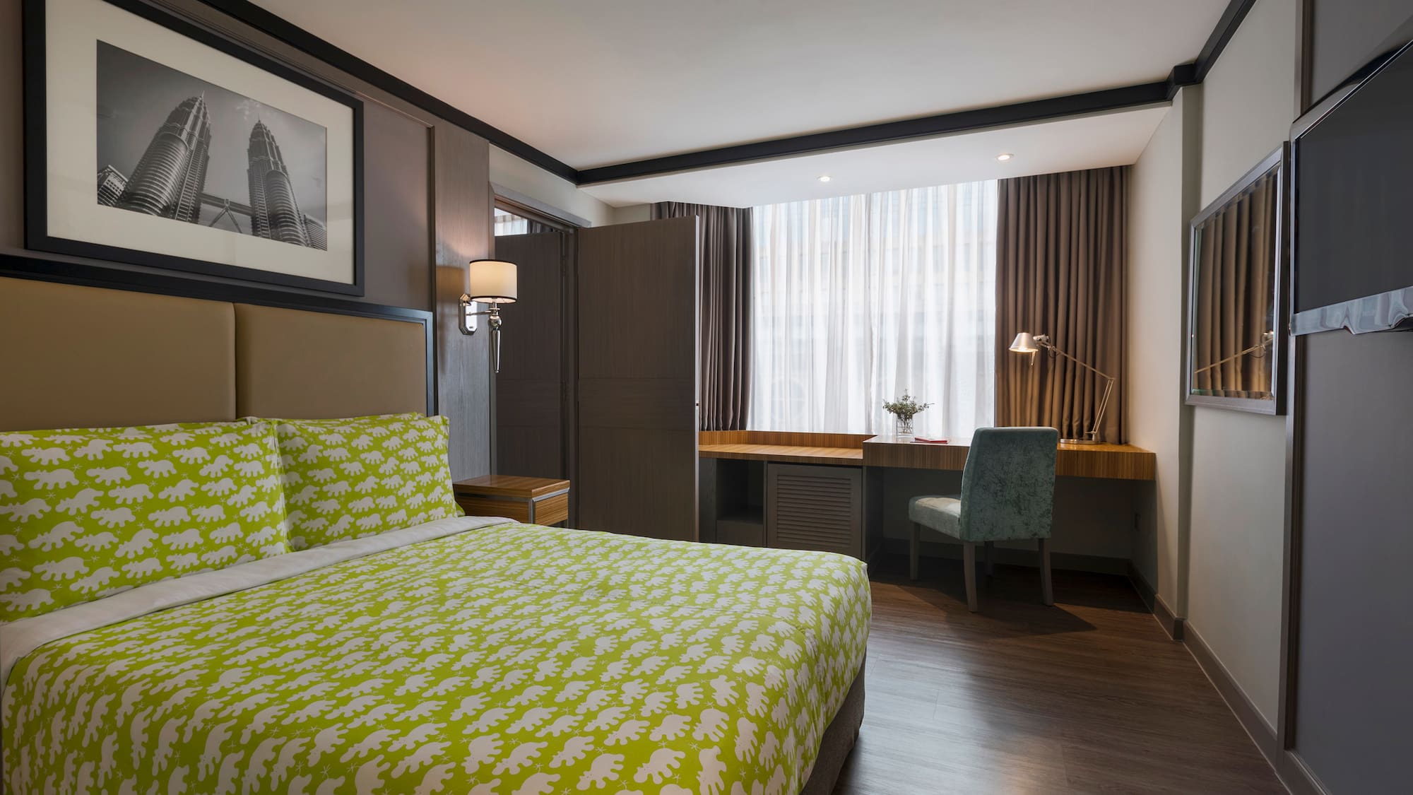 a room with a bed and a desk