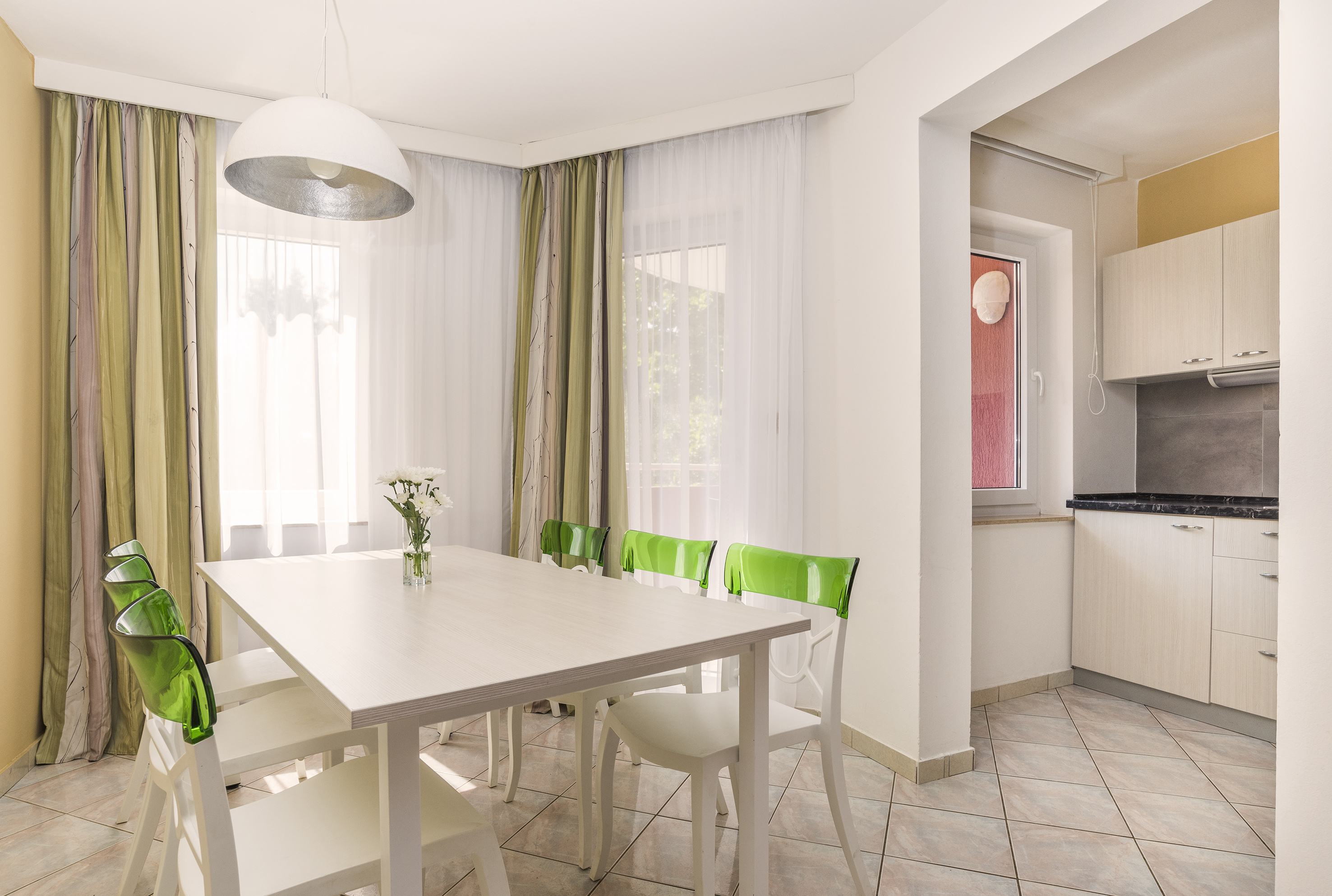 a white table and chairs in a room