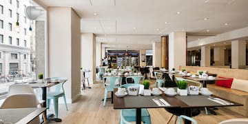 a restaurant with tables and chairs