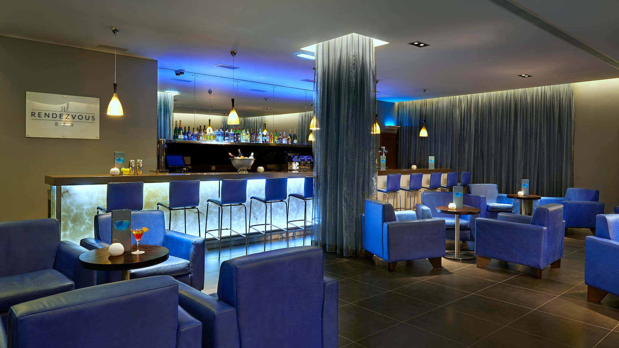 a room with blue chairs and tables