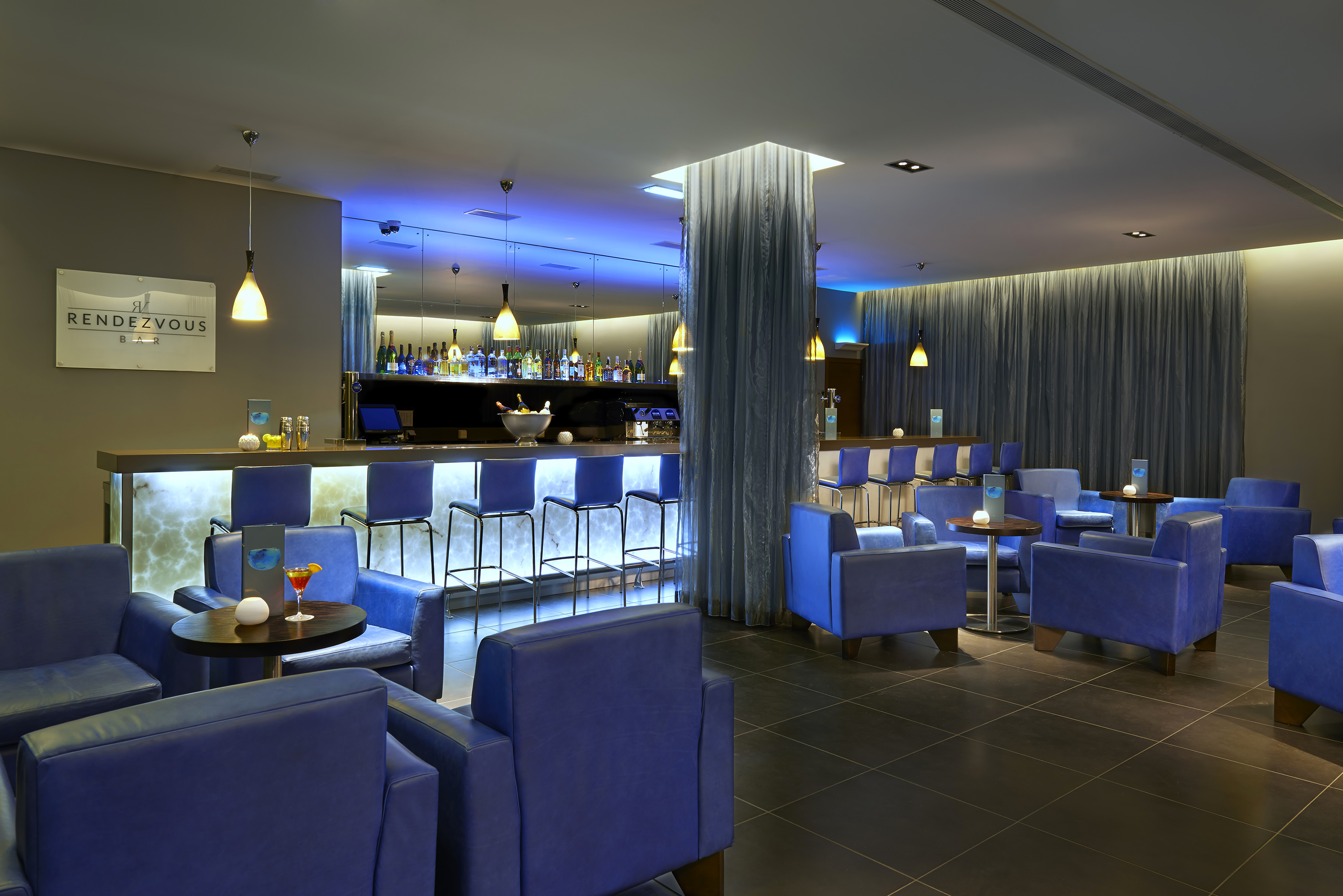 a room with blue chairs and tables