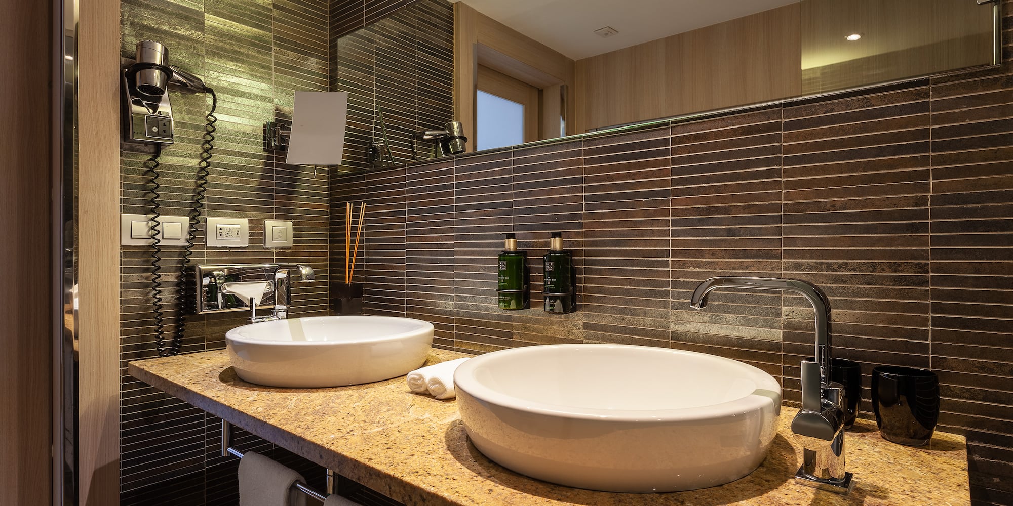 a bathroom with a sink and mirror