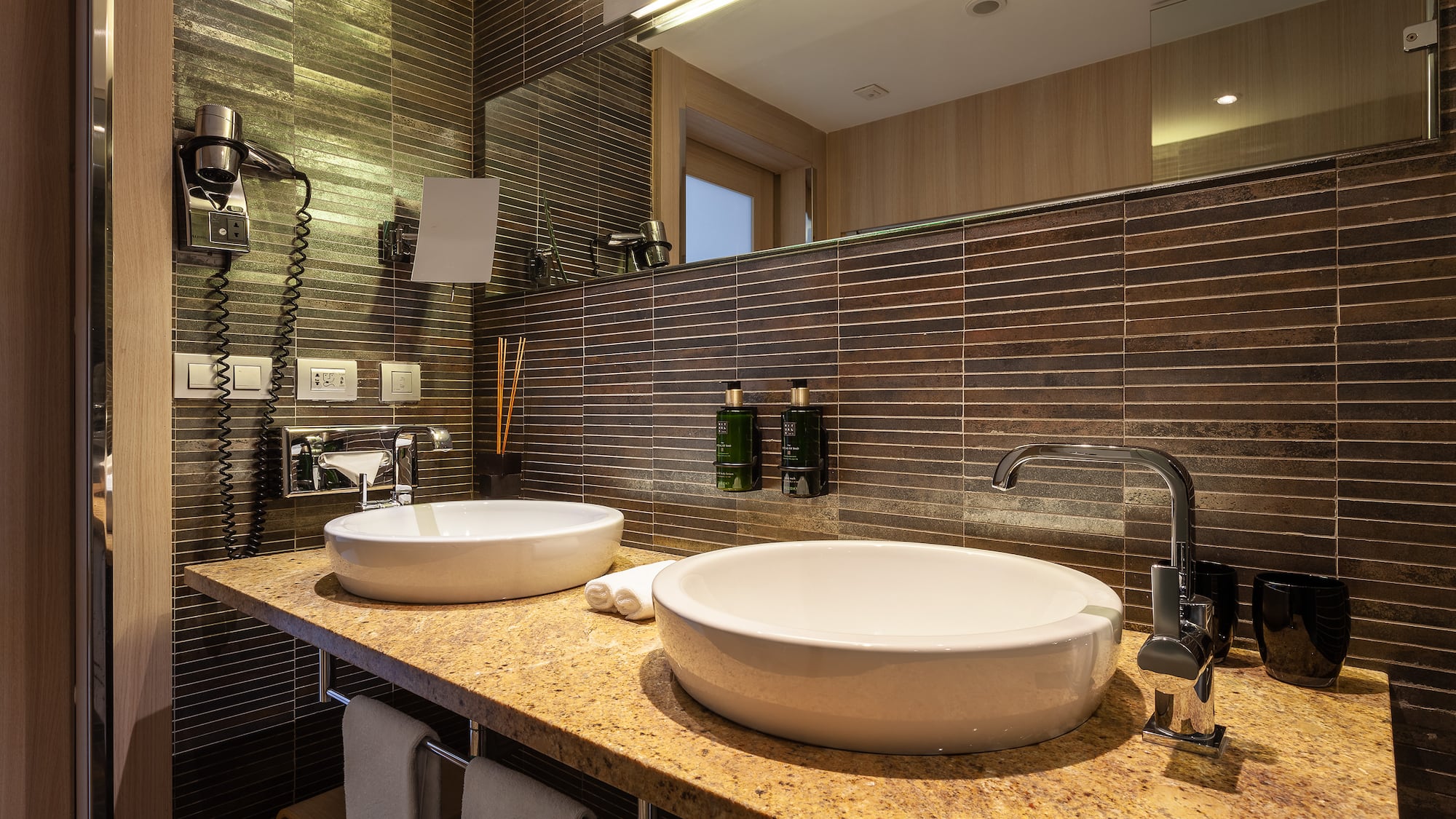 a bathroom with a sink and mirror