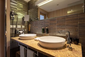 a bathroom with a sink and mirror