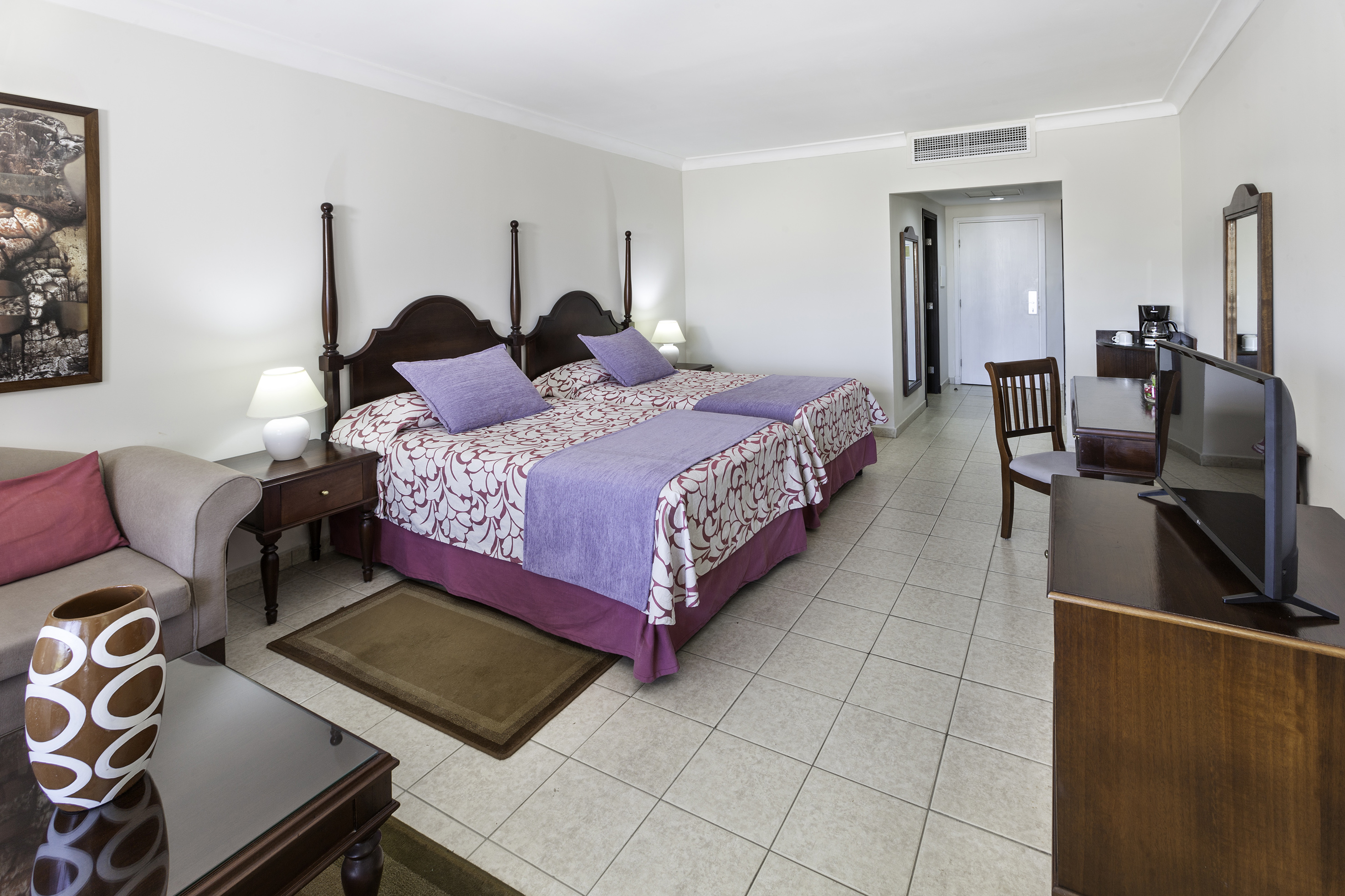 a bedroom with a bed and a table