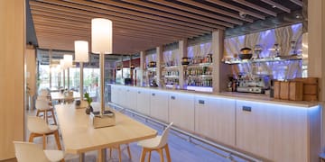 a bar with a table and chairs