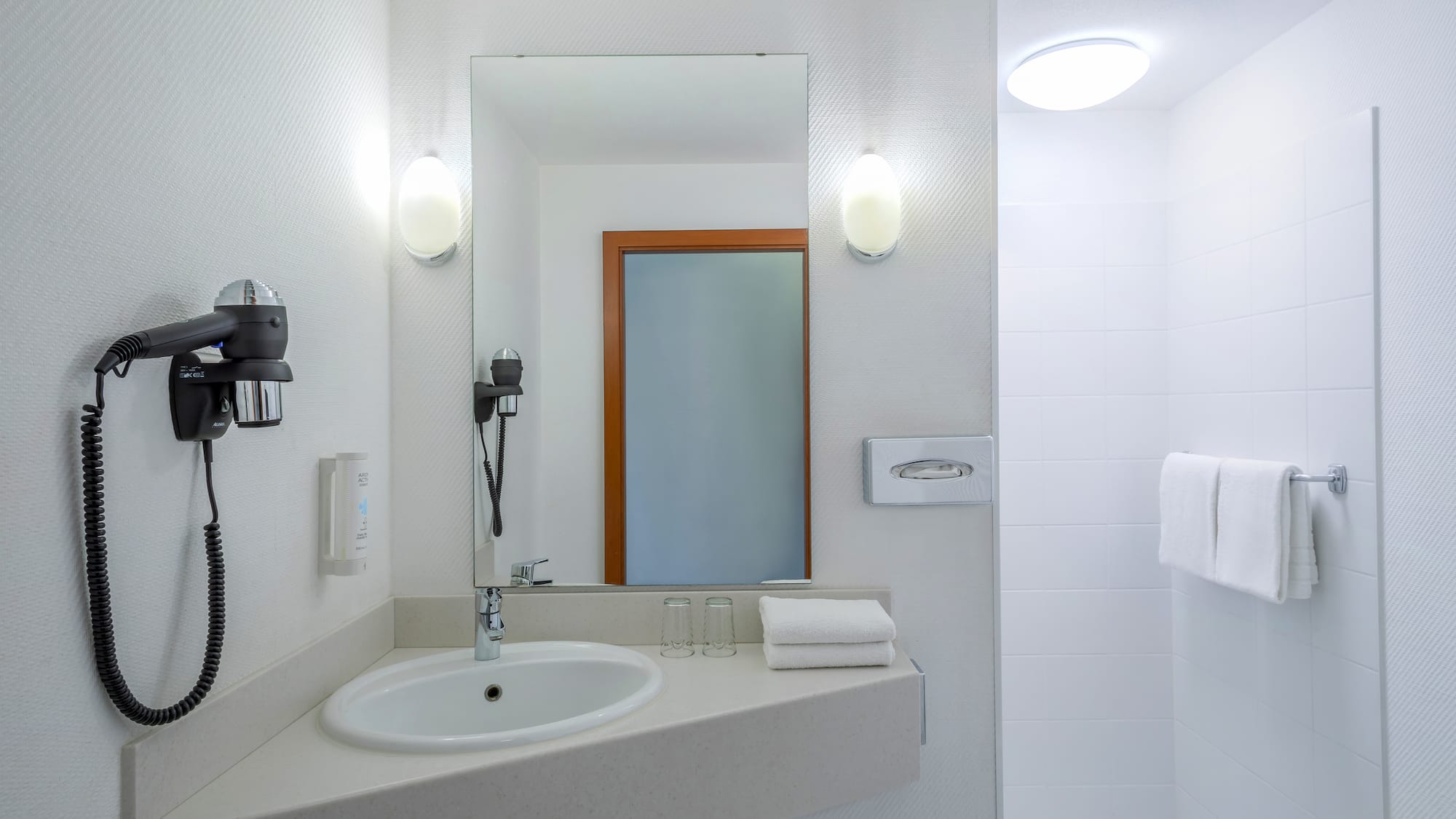 a bathroom with a mirror and sink