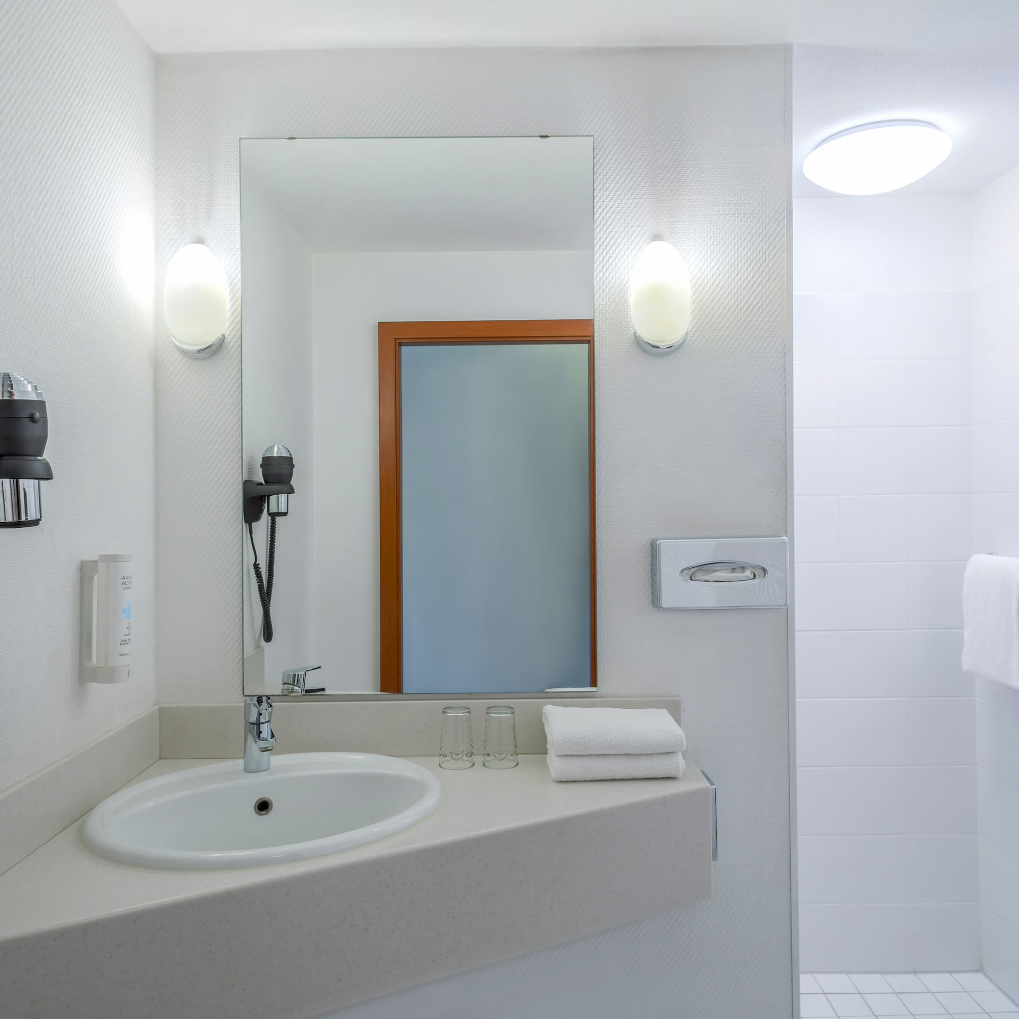 a bathroom with a mirror and sink