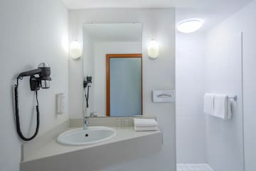 a bathroom with a mirror and sink