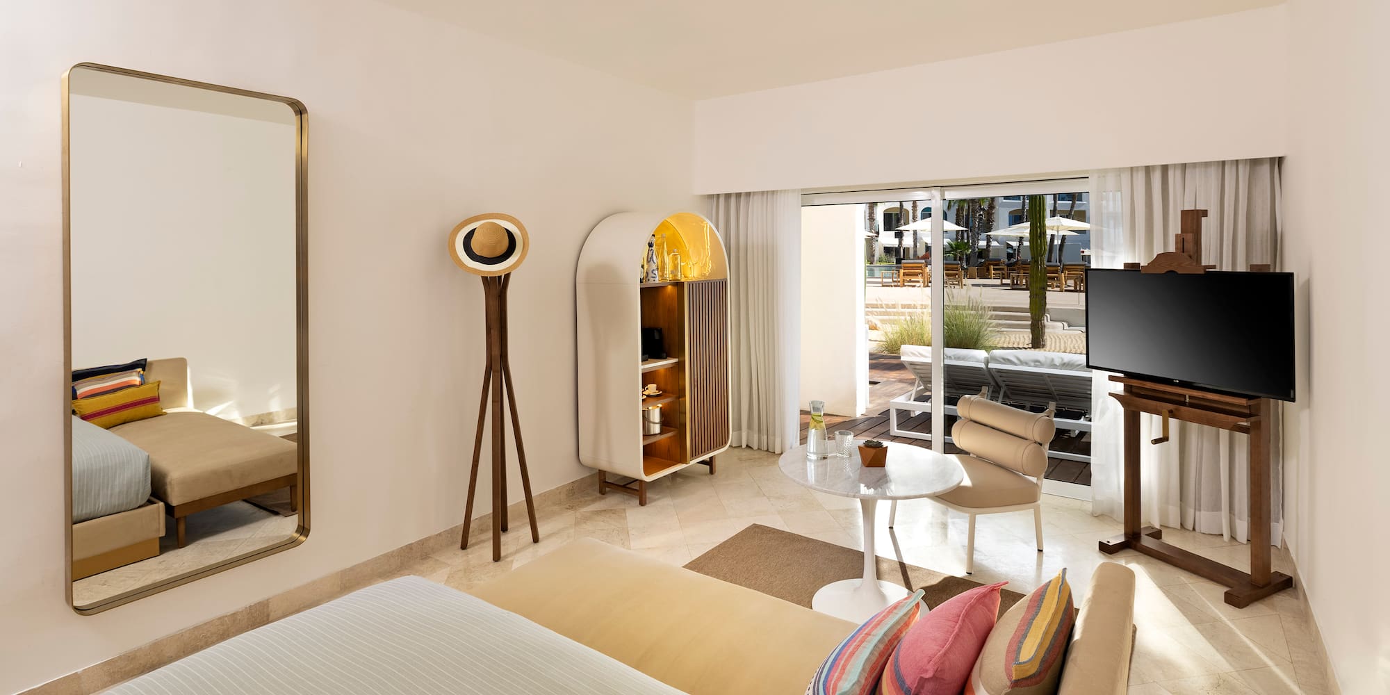 a room with a bed and a television