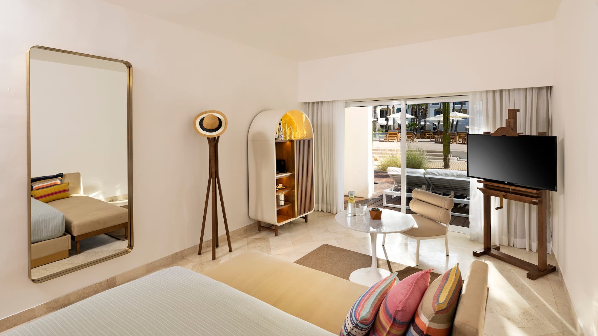 a room with a bed and a television