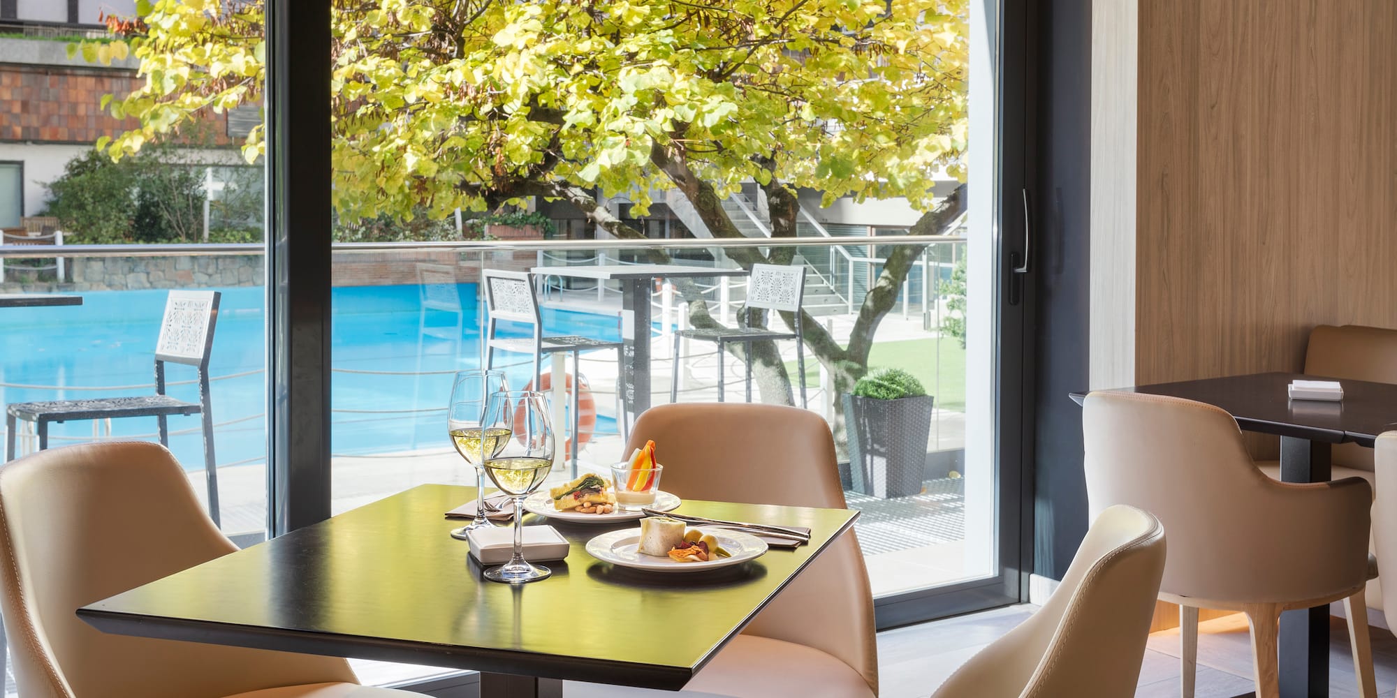 a table with food on it and wine glasses on it
