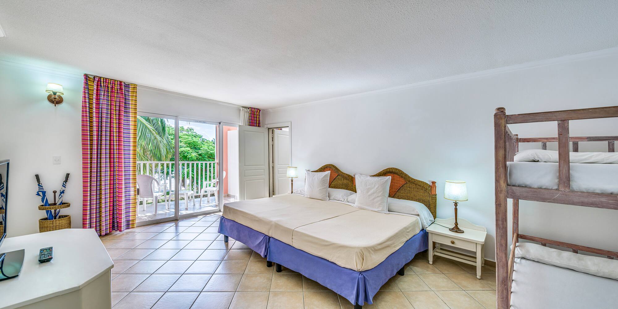 a bedroom with a bed and a glass door