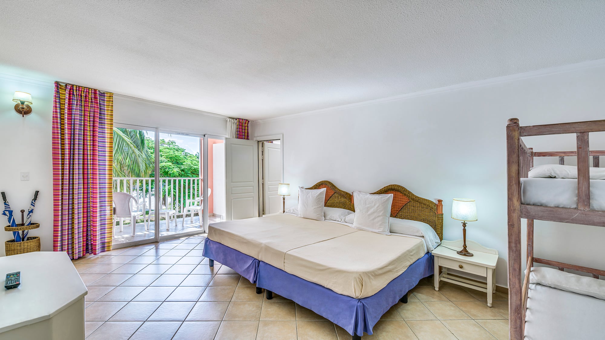 a bedroom with a bed and a glass door