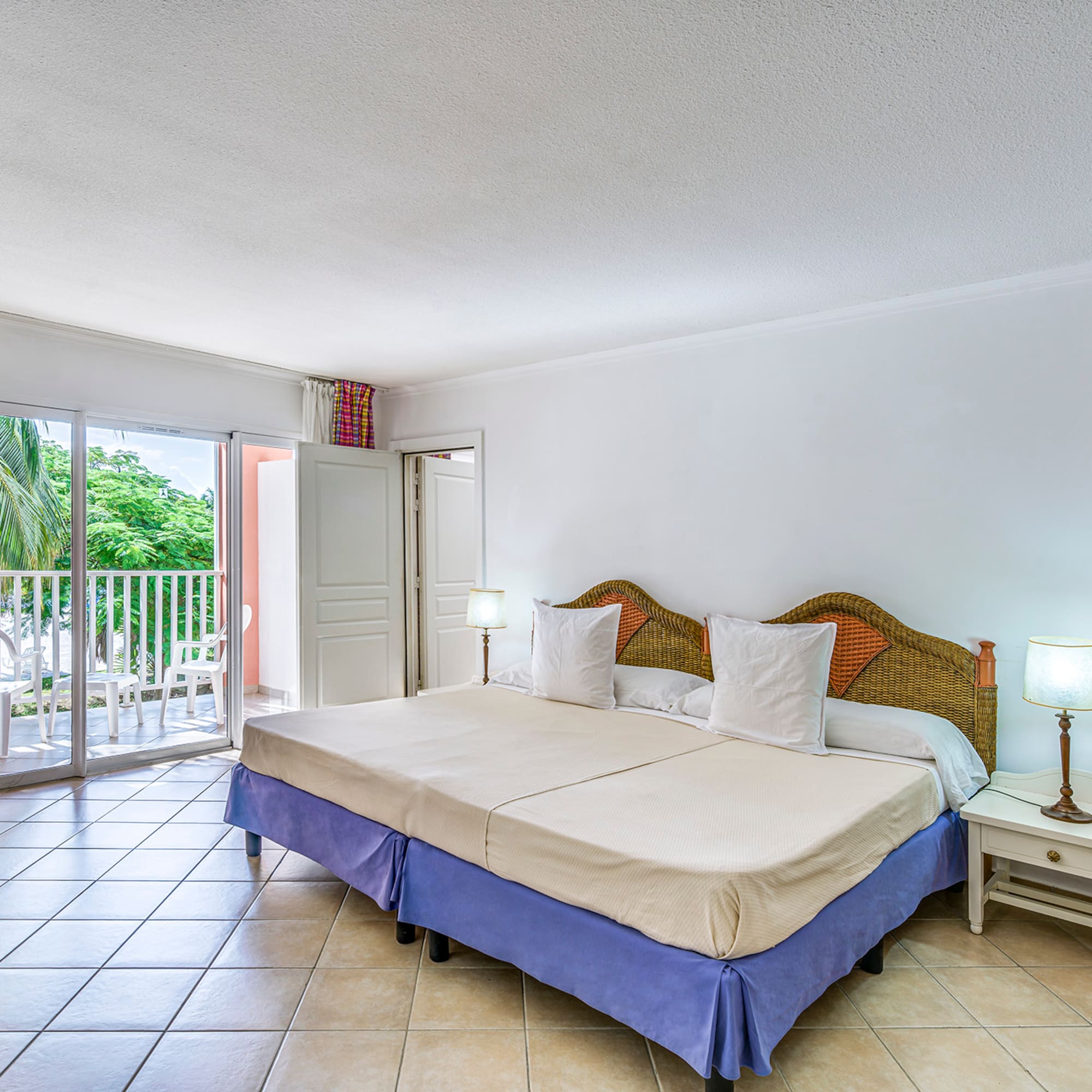 a bedroom with a bed and a glass door