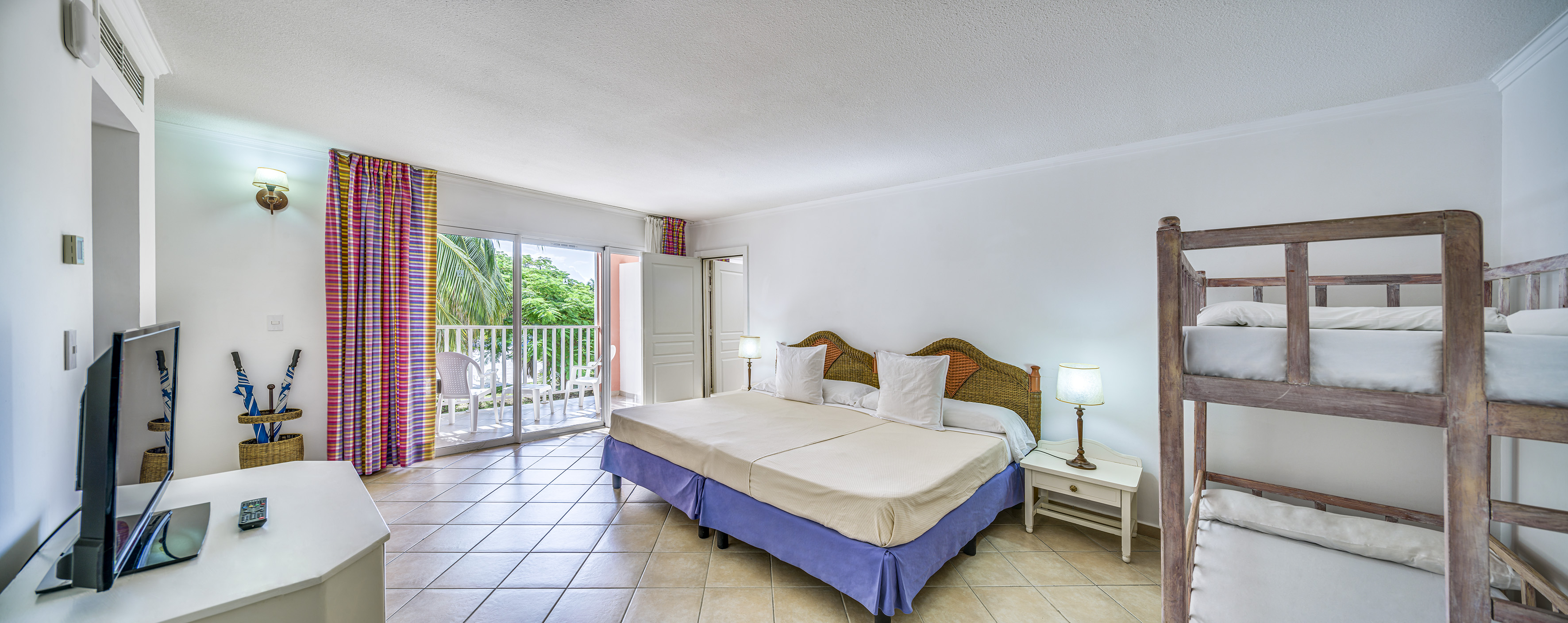 a bedroom with a bed and a glass door