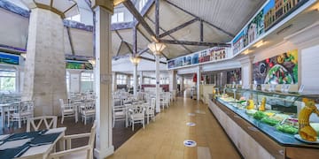 a restaurant with tables and chairs