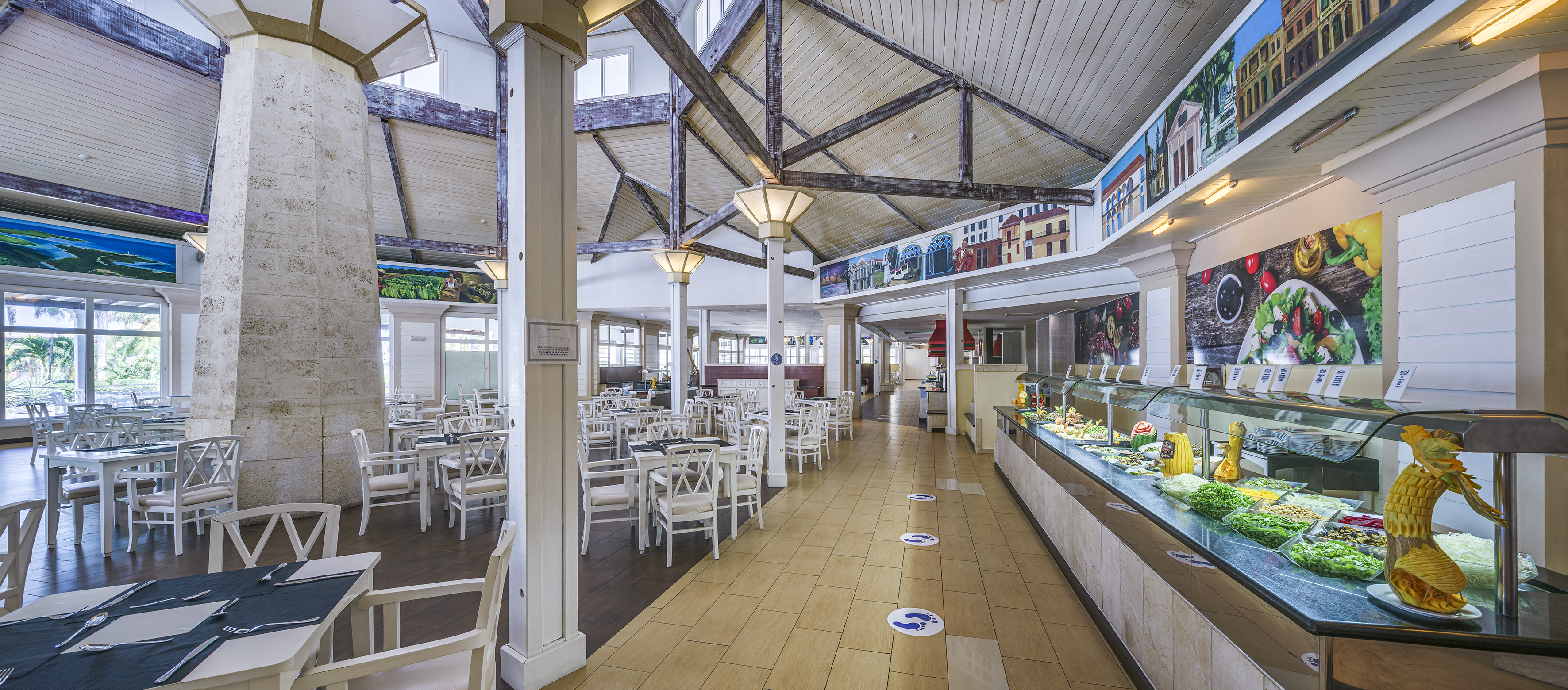 a restaurant with tables and chairs