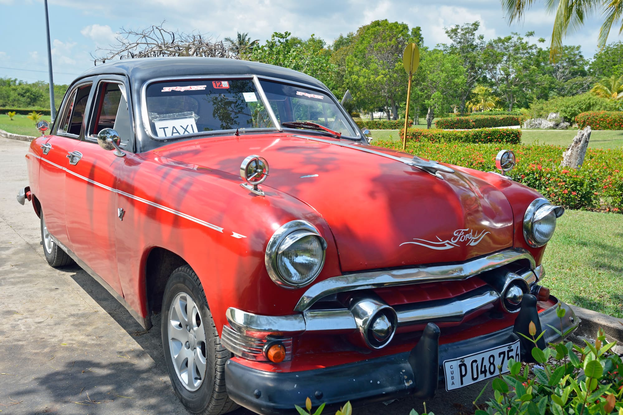 a red car parked on a road