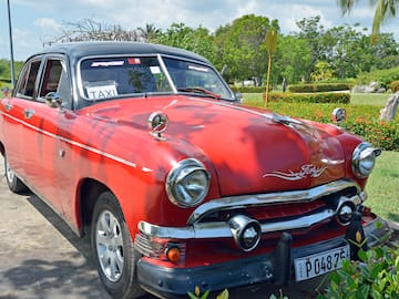 a red car parked on a road