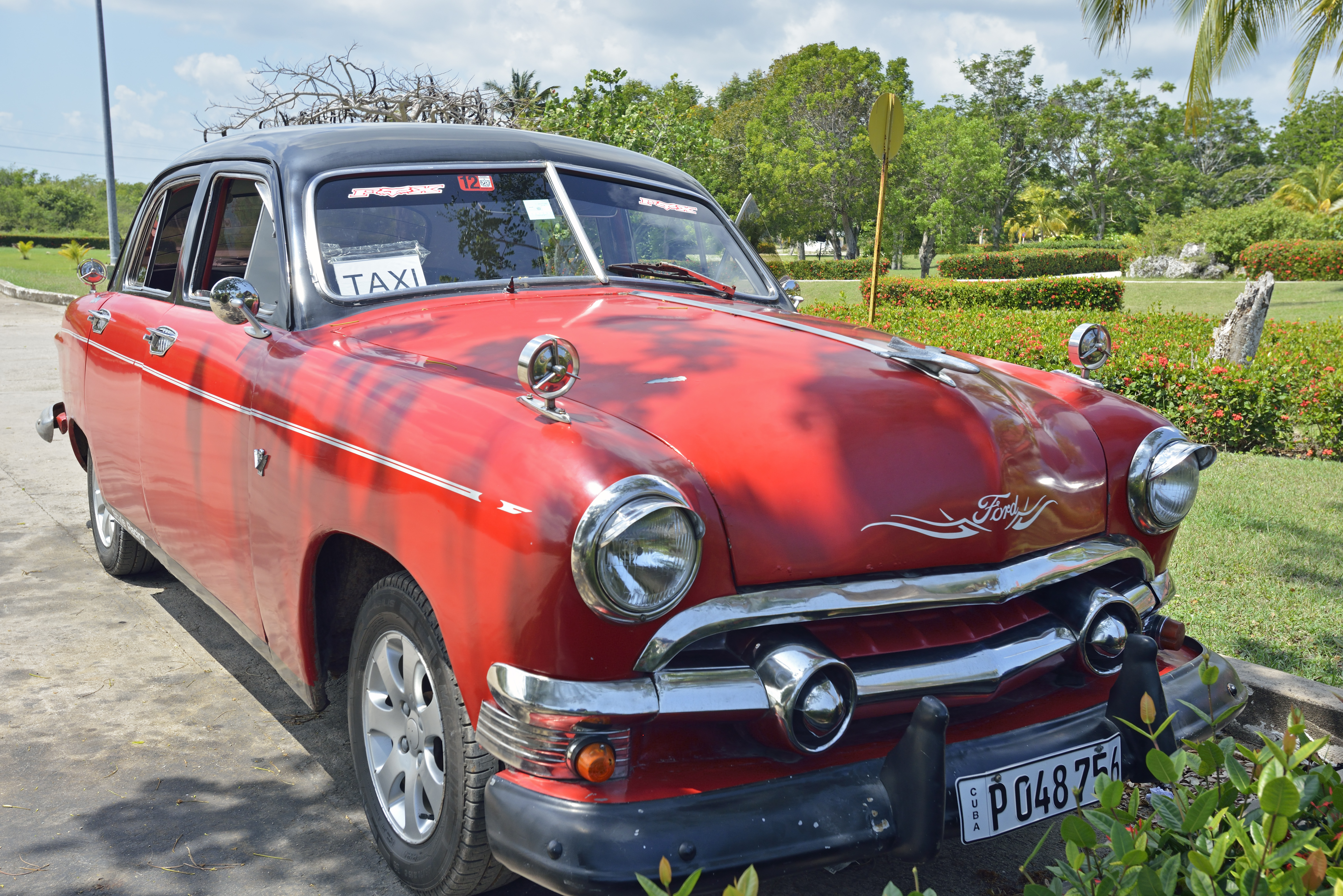 a red car parked on a road