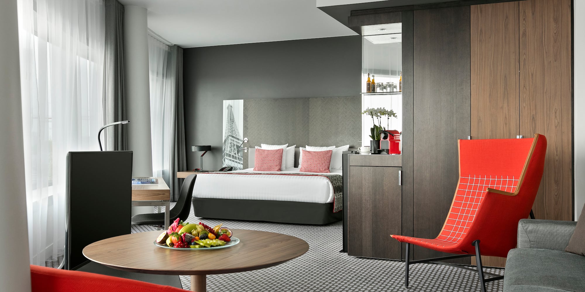 a room with a bed and a table with chairs