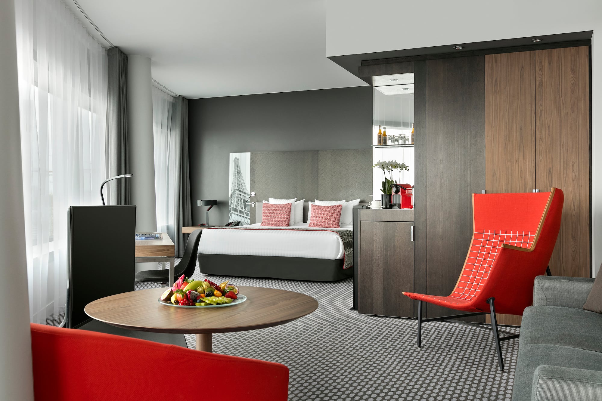 a room with a bed and a table with chairs