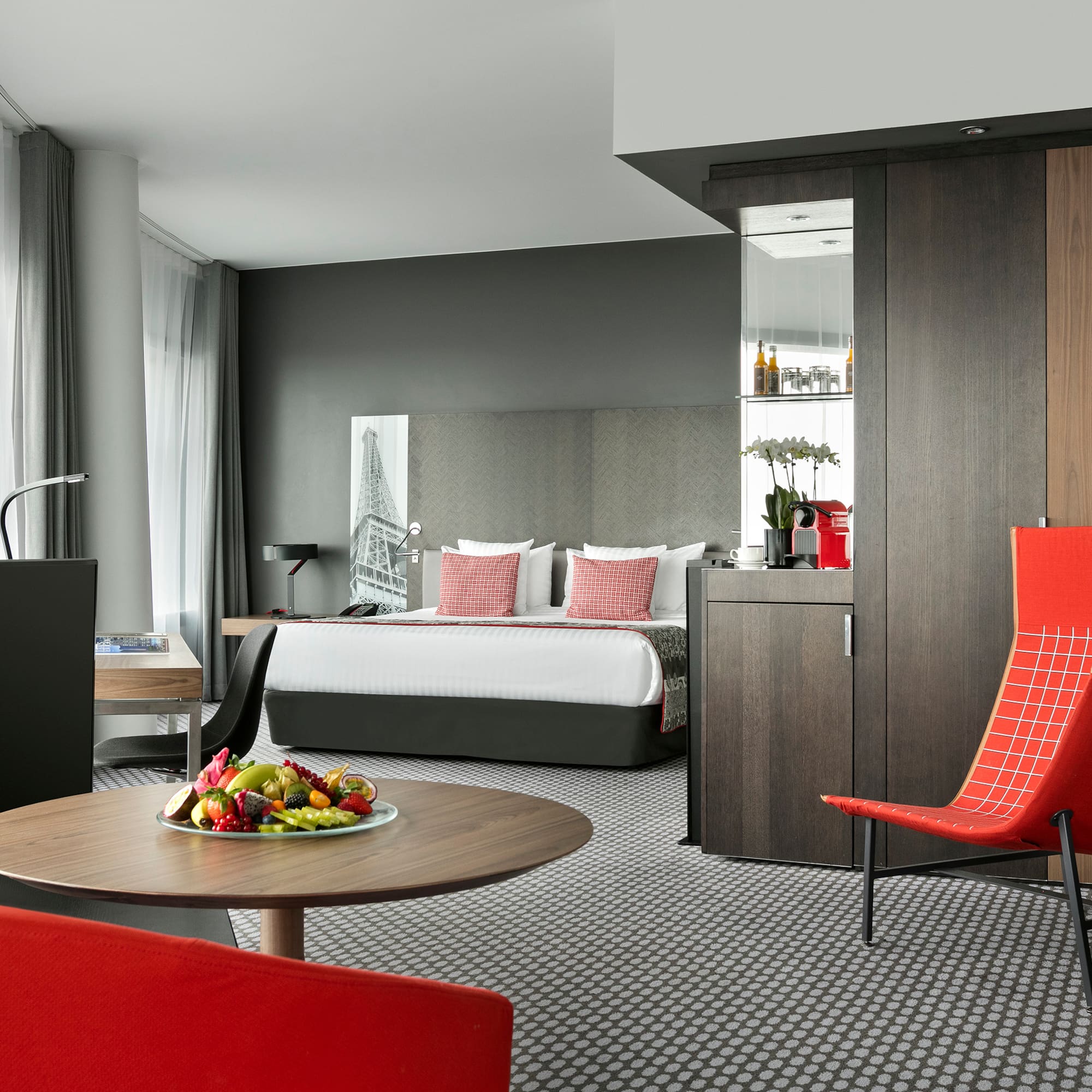 a room with a bed and a table with chairs