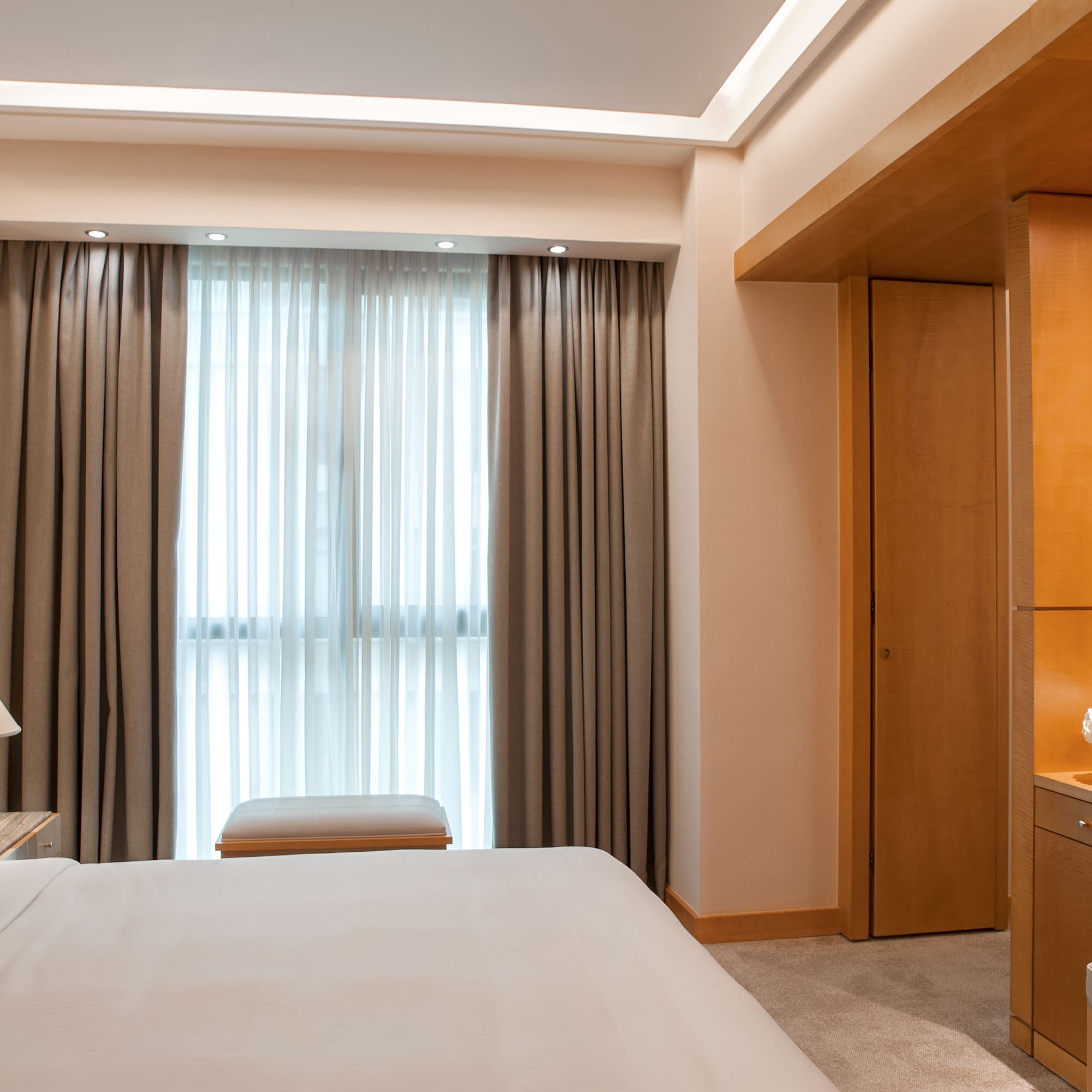 a bedroom with a bed and a desk