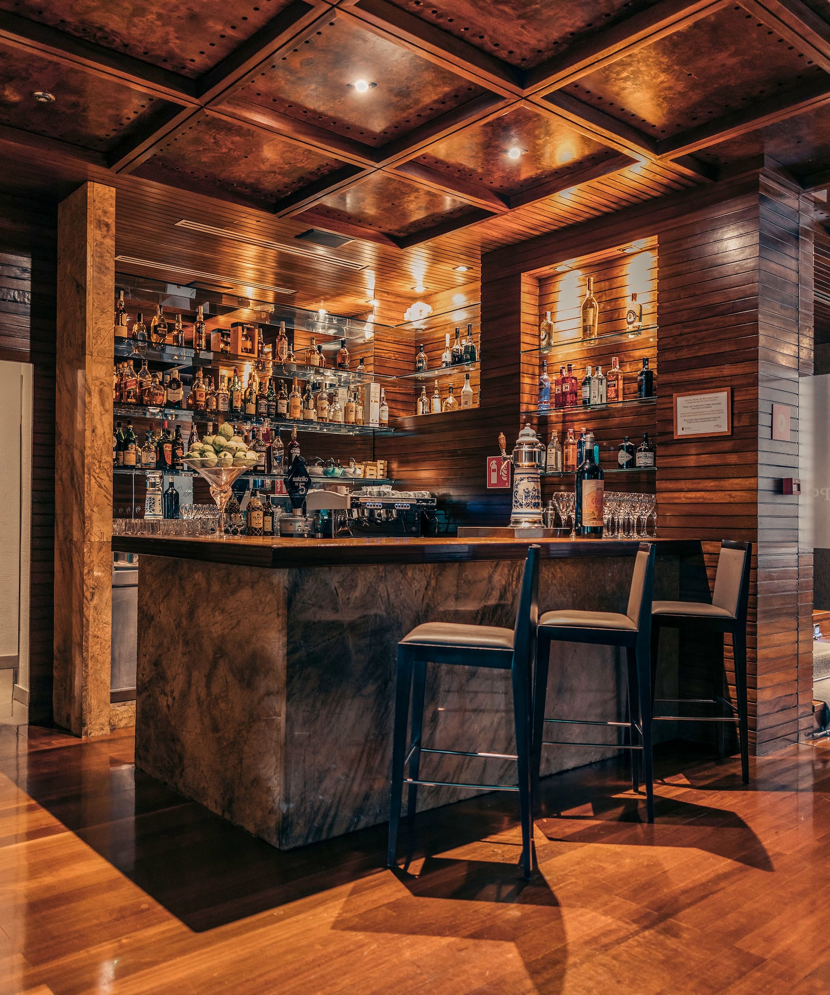 a bar with bottles on shelves