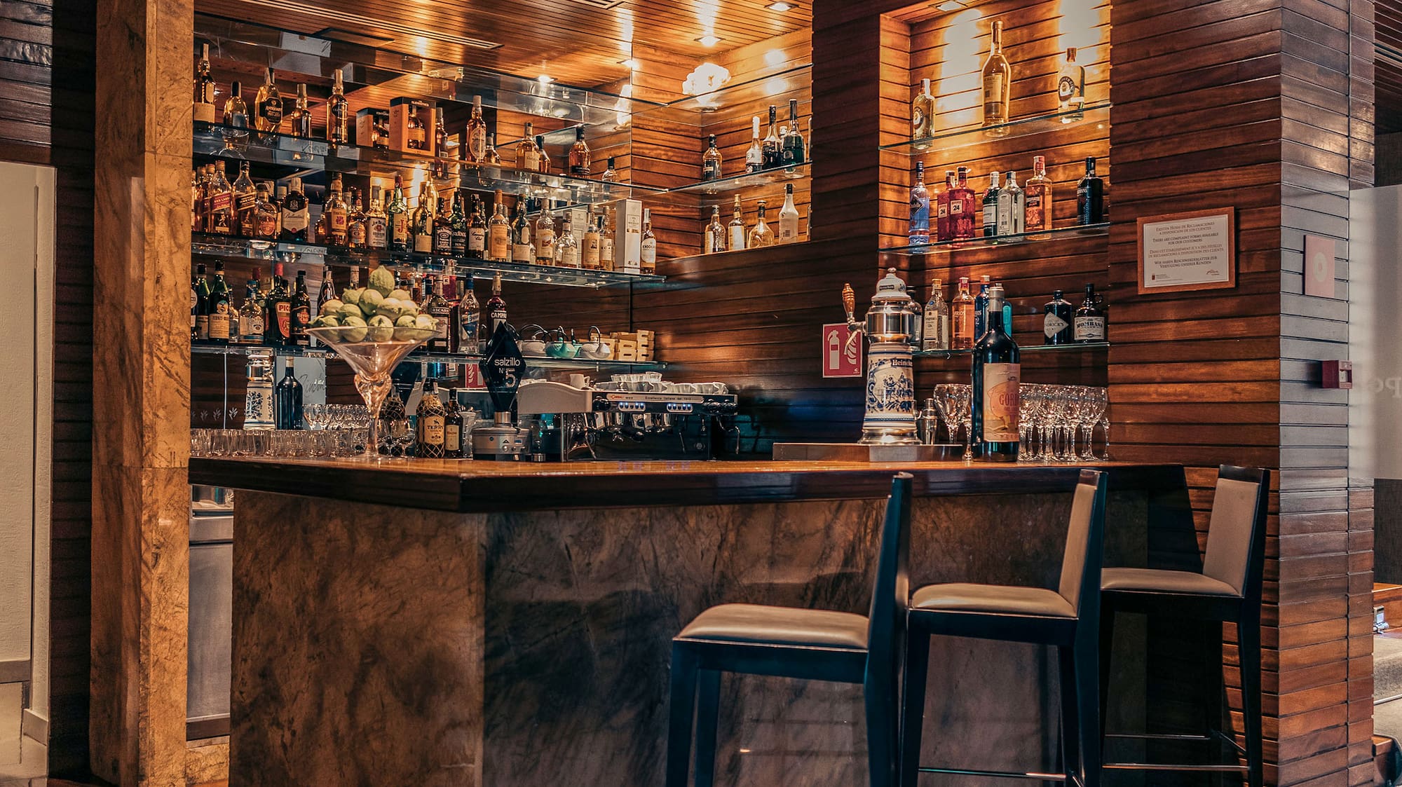 a bar with bottles on shelves
