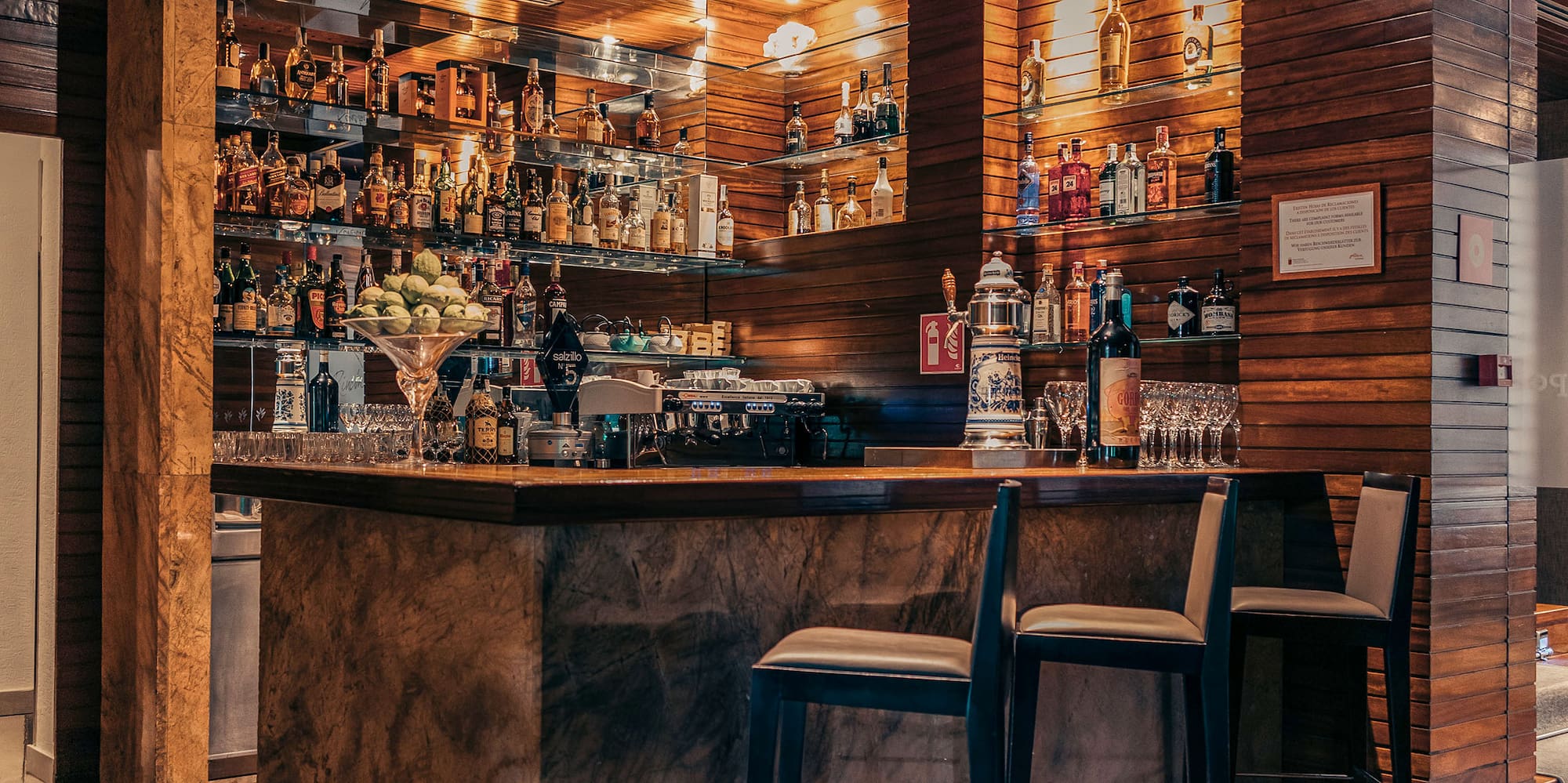 a bar with bottles on shelves
