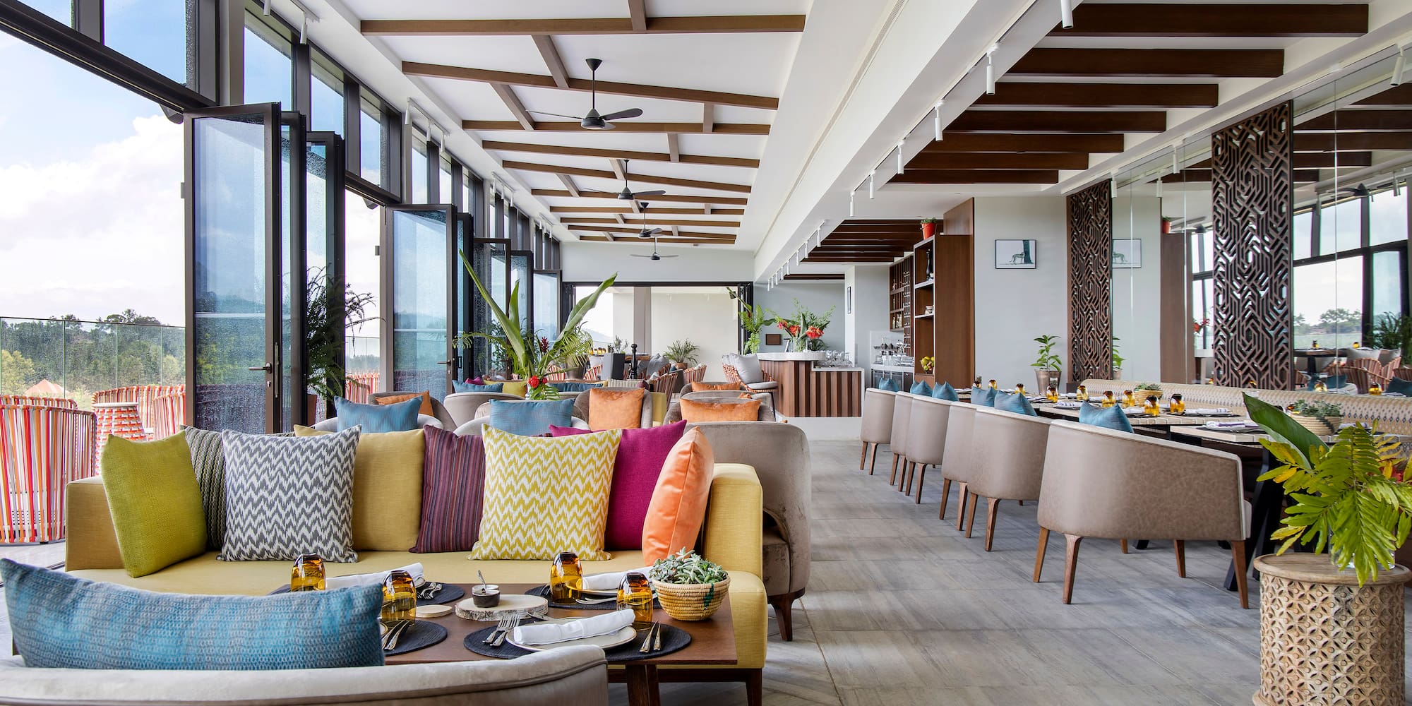 a room with couches and tables and chairs