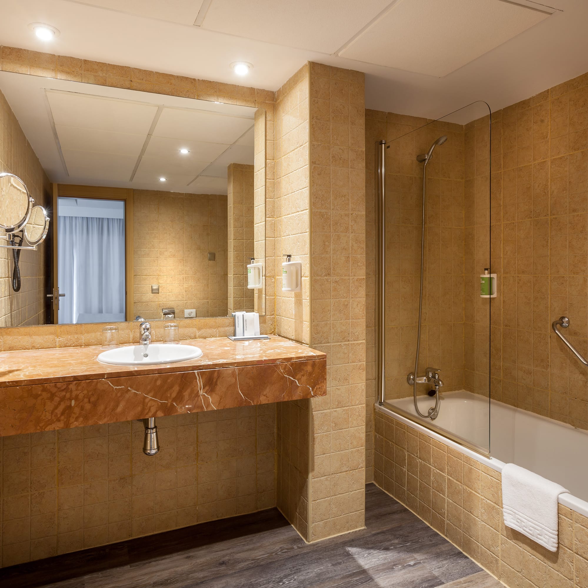 a bathroom with a sink and shower