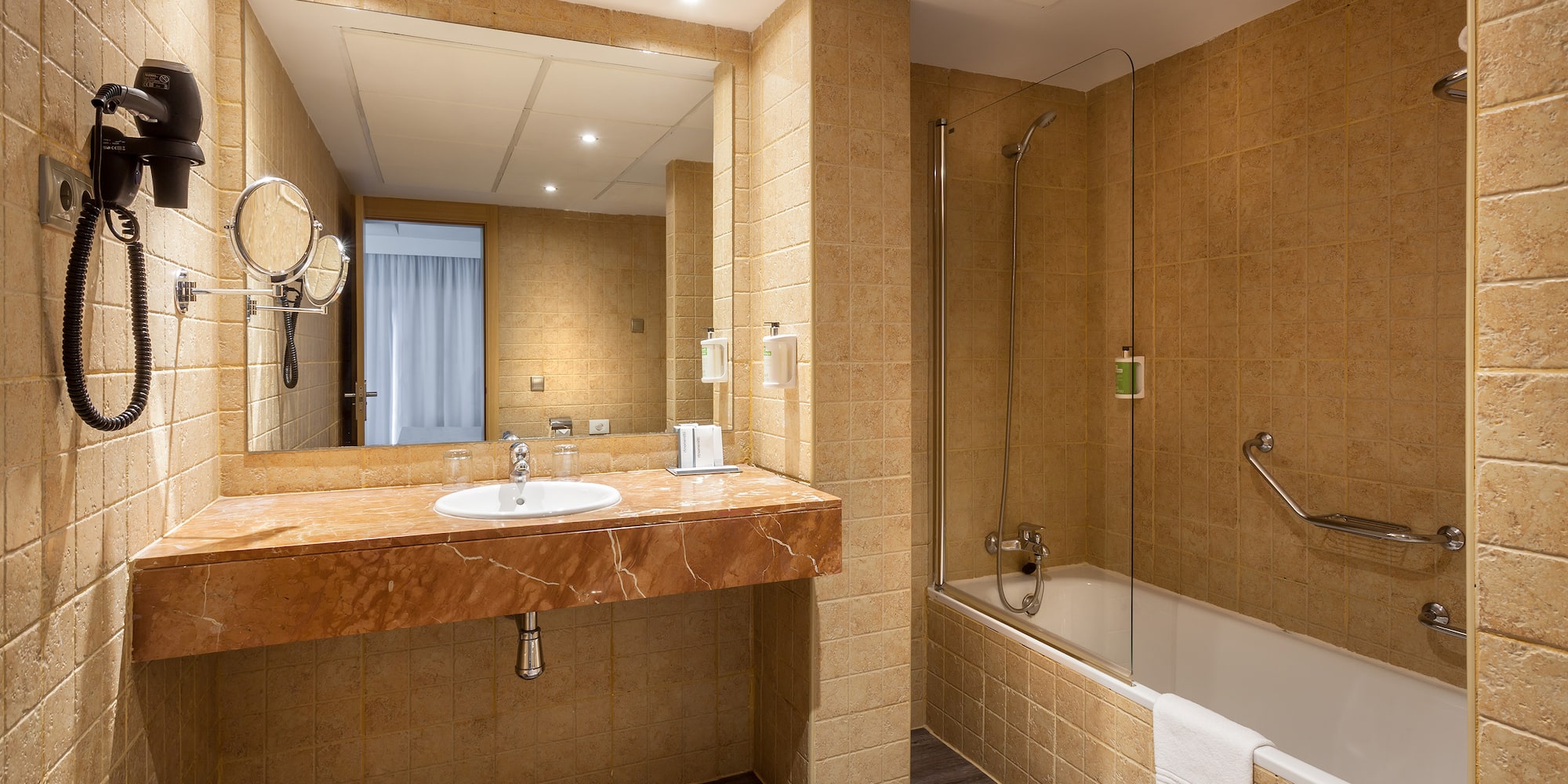 a bathroom with a sink and shower