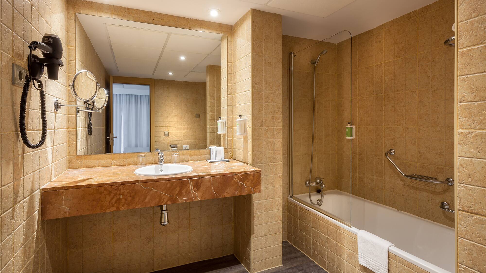 a bathroom with a sink and shower