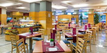 a restaurant with tables and chairs