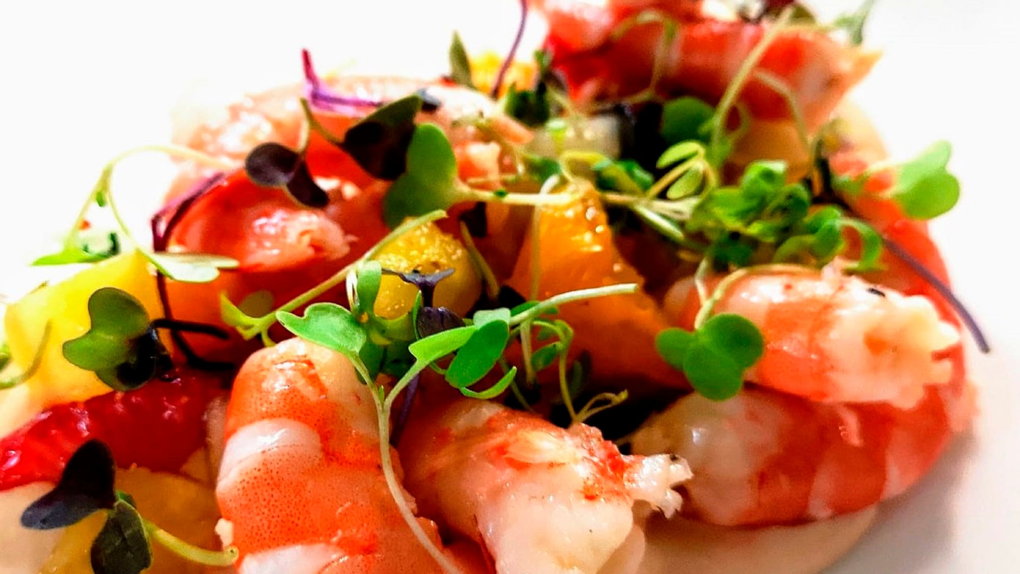 a plate of food with shrimp and vegetables