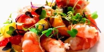 a plate of food with shrimp and vegetables