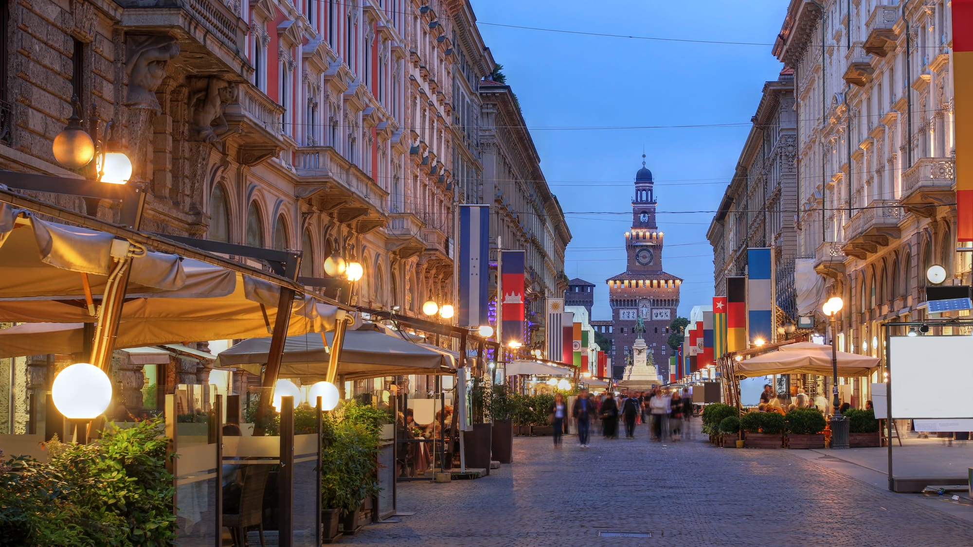 a street with people walking down it