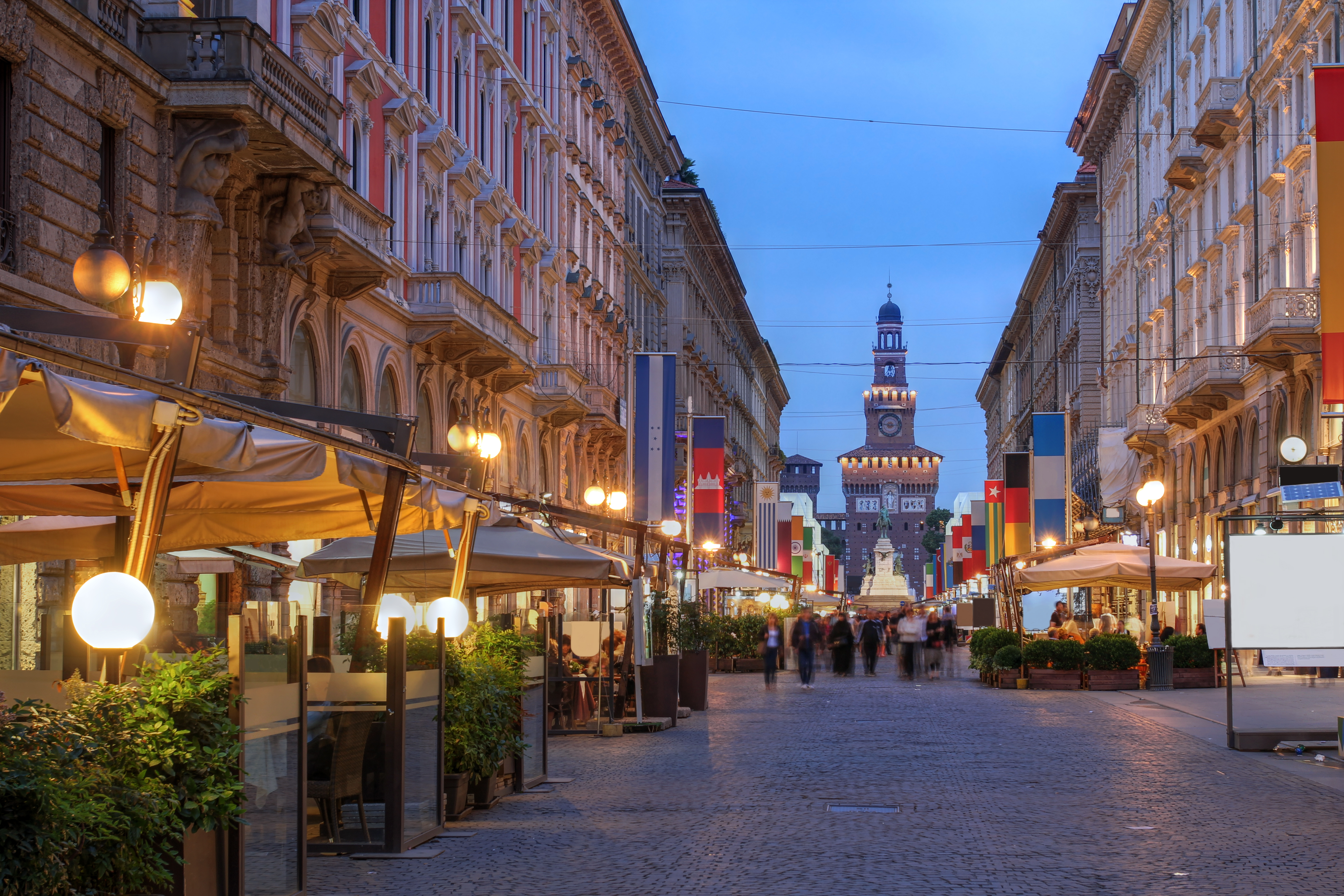 a street with people walking down it