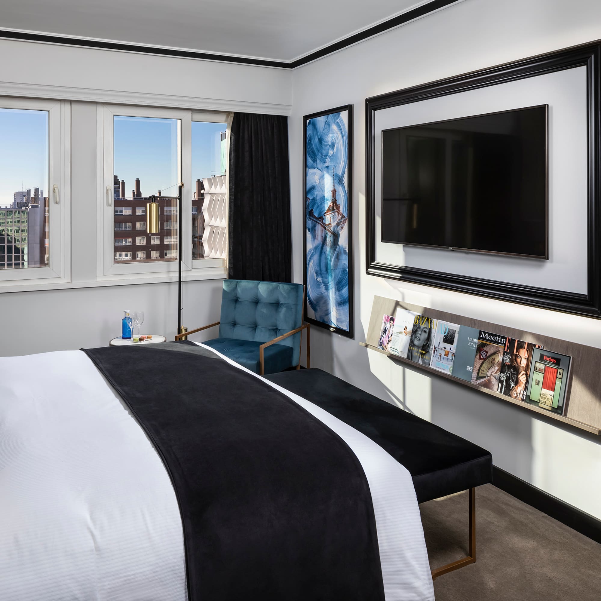 a bedroom with a bed and a chair