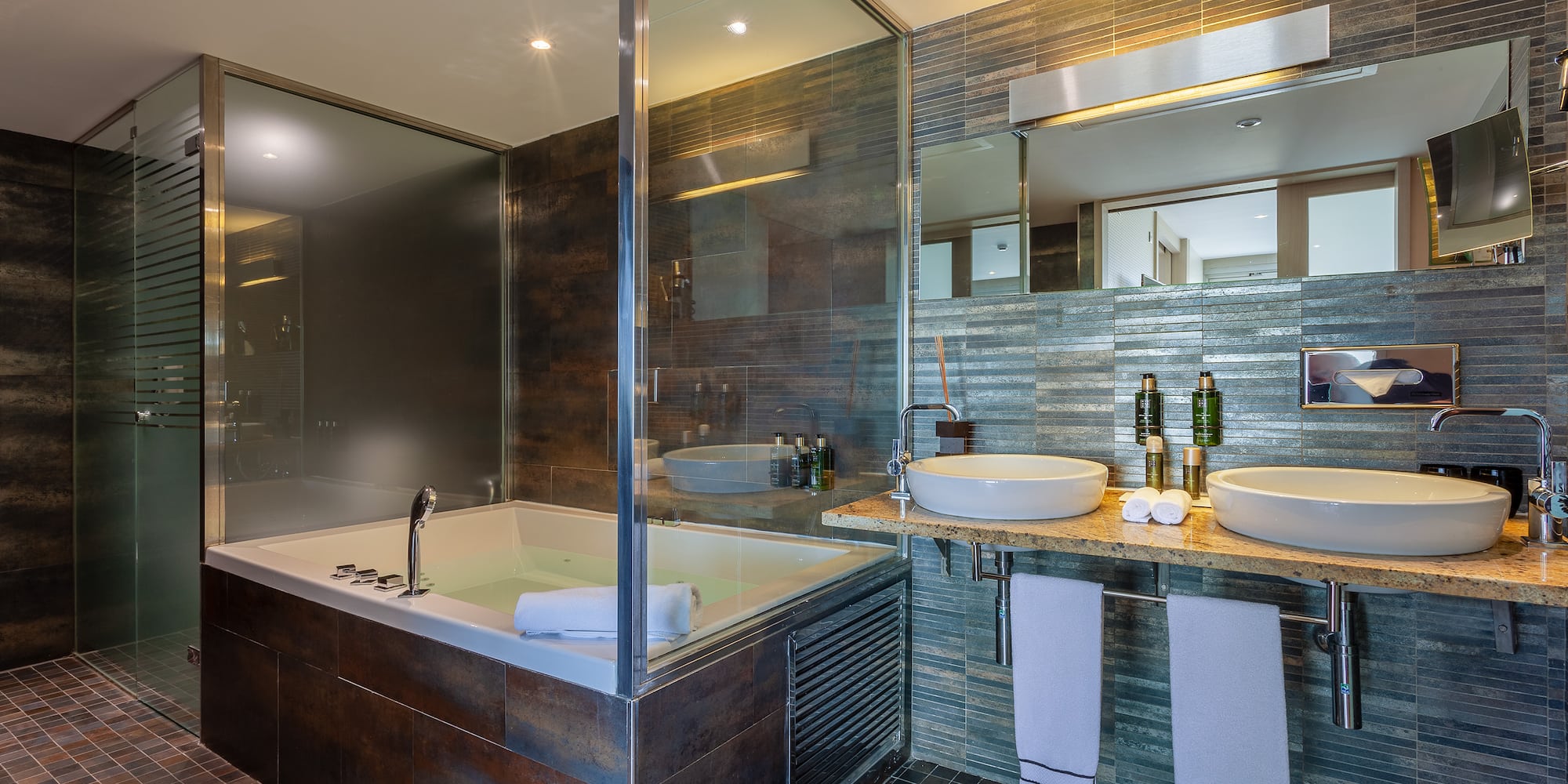 a bathroom with a tub and sink